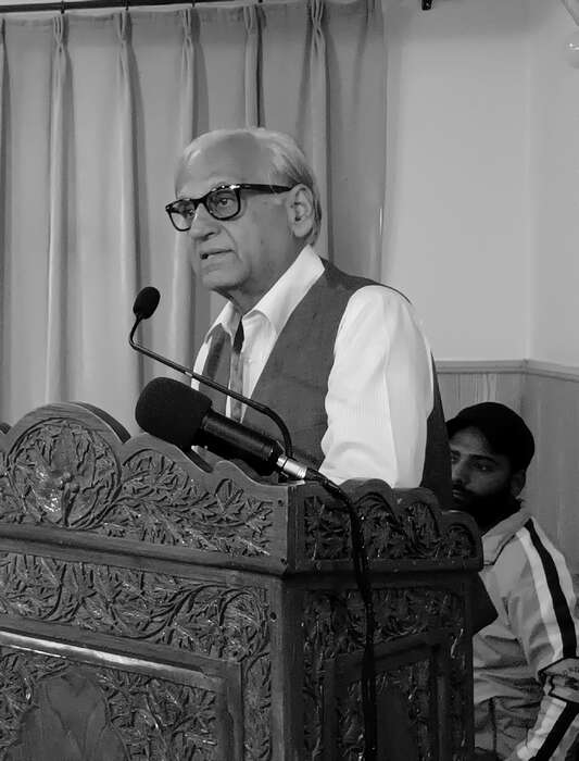 A scholar delivering a lecture at the festival podium