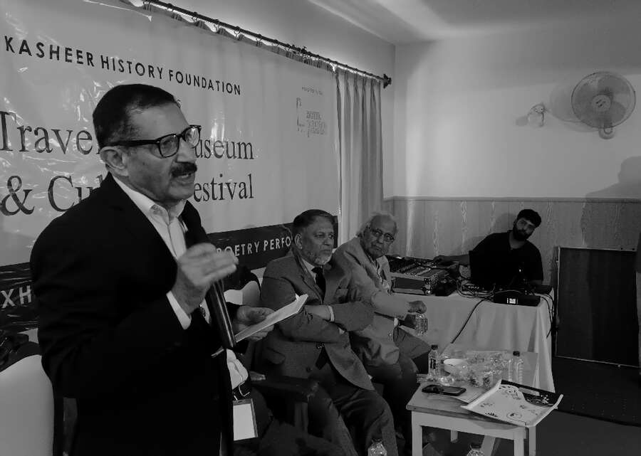 A speaker making a point during a panel session