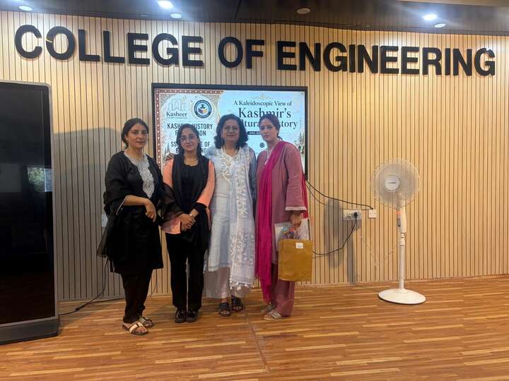 Organisers and volunteers with certificates at the seminar display