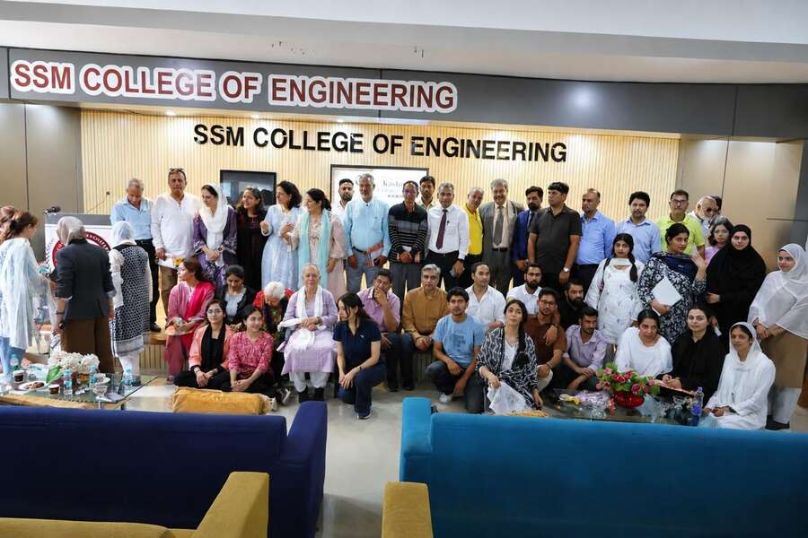 Speakers, organisers, faculty and students gathered for a group photograph